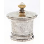 A French empire silver jar and cover, flared cylindrical and engraved with scrolling foliage