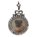 A paste locket set with a miniature of a pug dog, c1900,  the oval frame suspended from a ribbon bow