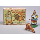 A Japanese lithographed tinplate clockwork clown circus lion toy,  c1960  replica box, Good