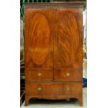 A Victorian mahogany and line inlaid wardrobe, in George III style, with dentil and pear drop