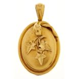 A Victorian gold locket, applied with serpent and ivy leaves, 46mm, 11.3g Minor edge dent and
