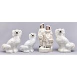 One and a pair of Staffordshire earthenware spaniels and a flatback group, 19th c, various sizes