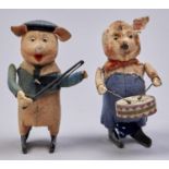 Two  Schuco  mechanical tinplate, felt and cloth covered figural  pig