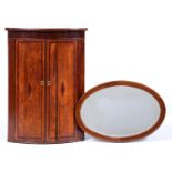 A Victorian bow fronted oak and crossbanded hanging corner cupboard, 105cm h and an oval mahogany