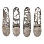 A set of four Scottish Elizabeth II egg spoons, the openwork handle variously decorated with salmon,