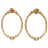 A pair of Victorian miniature oval giltwood and composition mirrors, with floral cresting, 31cm h