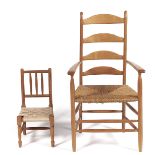 An Arts and Crafts ash ladder back elbow chair, rush seated, seat height 42cm and a beech child's