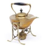 An English brass tea kettle, early 20th c, ebonised handle and knop, 24.5cm h including lamp