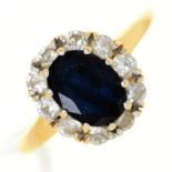 A sapphire and diamond oval cluster ring,  in 18ct gold,  Birmingham 1998, 3.8g, size J½