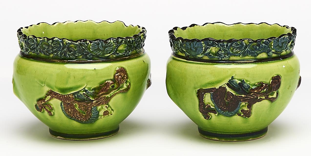 Two lime green, blue and brown majolica miniature dragon jardinieres, early 20th c, 80mm h Good