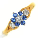 A sapphire and diamond cluster ring,  in 18ct gold, London 1985, 3g, size O Sapphires chipped
