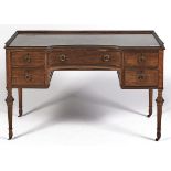 A concave centred mahogany dressing table, early 20th c, in Regency style and in the manner of