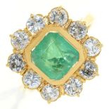 An emerald and diamond cluster ring, in gold marked 750, 7.7g, size O Good condition