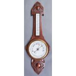 A carved oak aneroid barometer, early 20th c, with mercury thermometer, 85cm h, a 1930's Smiths