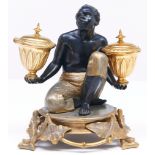 A French gilt, silvered and bronze patinated spelter slave figural encrier, late 19th c, in the form
