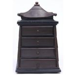 Miniature Furniture. A brown and black painted wood pagoda form chest of drawers, 19th c, with brass