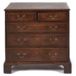A George III oak chest of drawers, bracket feet, the sides of stained fruitwood, 79cm h; 46 x 81cm