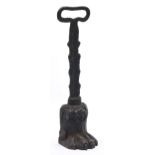 A Victorian cast iron lion's paw doorstop, 35cm h Dirty, light rust but undamaged