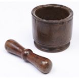 Treen. A fruitwood pestle and a sycamore mortar, mortar 13cm h Good condition