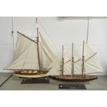 A collection of painted wood, plastic and other model sailing ships, boats, yachts and other