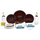 Breweriana. A quantity of Worthington earthenware ashtrays and German grained wood drink trays for