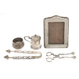 A pair of  George III silver sugar tongs, c1770, marks rubbed, maker's mark and lion passant, a pair