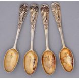 A set of four rare George II silver gilt teaspoons, Neptune Top pattern with basket of flowers back,