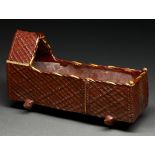 A British slipware model of a cradle, possibly Yorkshire, late 19th c, of red clay covered in