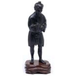 A Japanese bronze okimono of a man with a pipe, Meiji period, even black patina rubbed slightly in