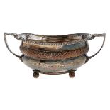 A Sheffield Plate sugar bowl, c1830, 21cm over handles Plating rubbed as evident from image but