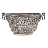 A Continental chased and pierced oval silver bowl, 19th c, with flared sides and scrolling