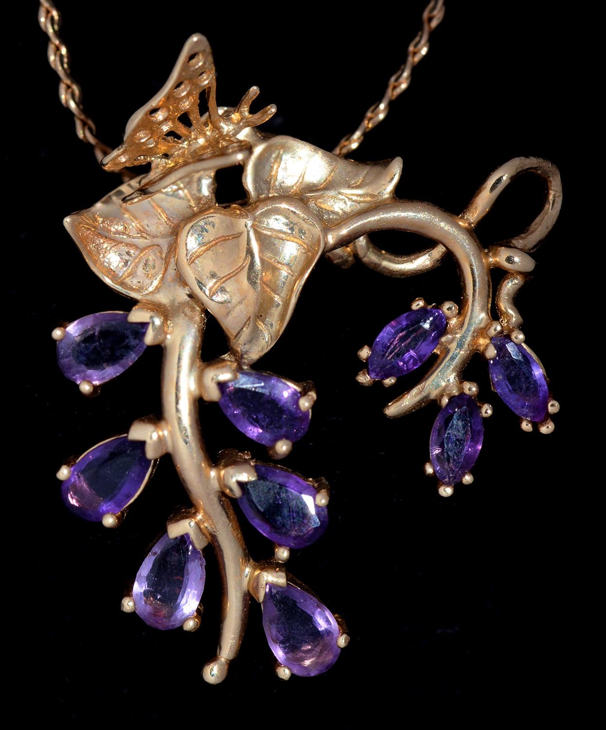 An amethyst flower pendant, in 14ct gold,  31mm, by The Franklin Mint, import marked London 1981 and