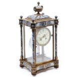A French gilt brass and champlevé enamel four glass mantel clock with pillars and urn finial, c1890,