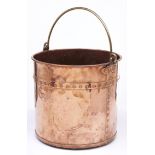 A Victorian copper cylindrical fuel bin, c1870, with brass swing handle, the body with studded band,