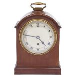 A mahogany mantel timepiece, c1930, in breakarched case with brass handle, 26cm h excluding handle