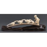 A Tokyo School ivory okimono of a boy and of geese, 28cm l, signed underneath, wood stand Good