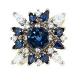 A sapphire and diamond cluster ring,  the larger central sapphire and smaller evenly sized round