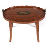 An oval painted satinwood gallery tray, early 20th c, the floral medallion in pearl surround and