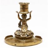 A brass kneeling child figural desk candlesticks, 19th c, on associated kidney shaped base,  13cm