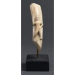 An ivory high relief carving of a European man, 19th c, with right arm upraised, 19cm h, on a