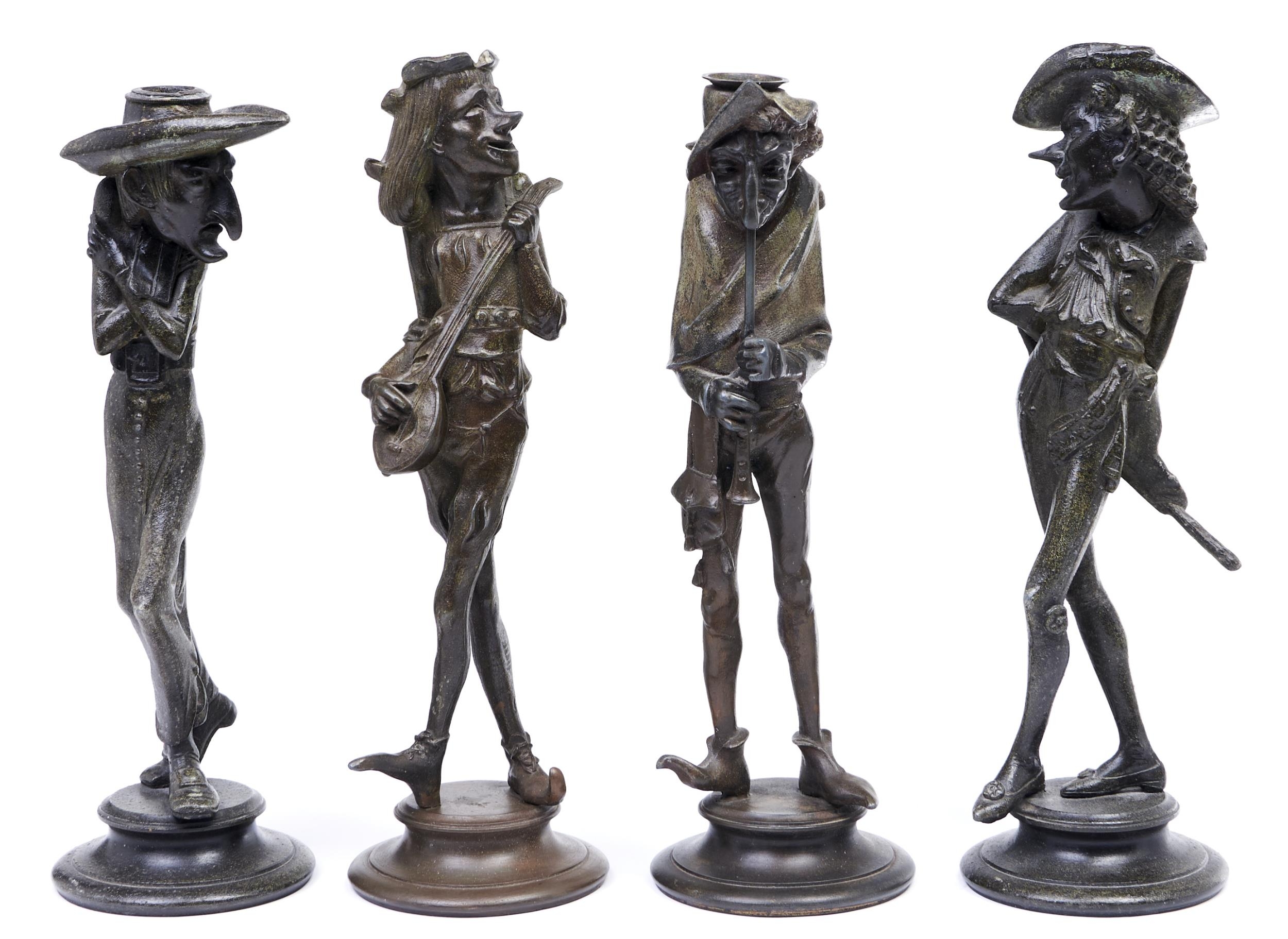 Two pairs of Continental bronzed spelter grotesque figural 'caricature' candlesticks, late 19th c,