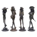 Two pairs of Continental bronzed spelter grotesque figural 'caricature' candlesticks, late 19th c,