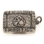 A George III silver vinaigrette, the lid engraved with leafage applied with a chased rosette and