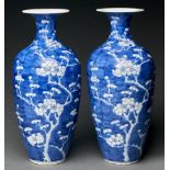 A pair of Chinese blue and white vases, first half 20th c, painted with prunus on a cracked ice