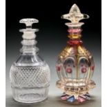 A cut glass Prussian decanter and stopper and a Bohemian rainbow flashed and wheel engraved glass