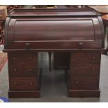 A Victorian mahogany cylinder desk, with maple veneered and fitted interior, sliding writing surface