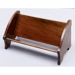 An Edwardian mahogany book trough, the ends crossbanded in satinwood and line inlaid, 36cm l Good