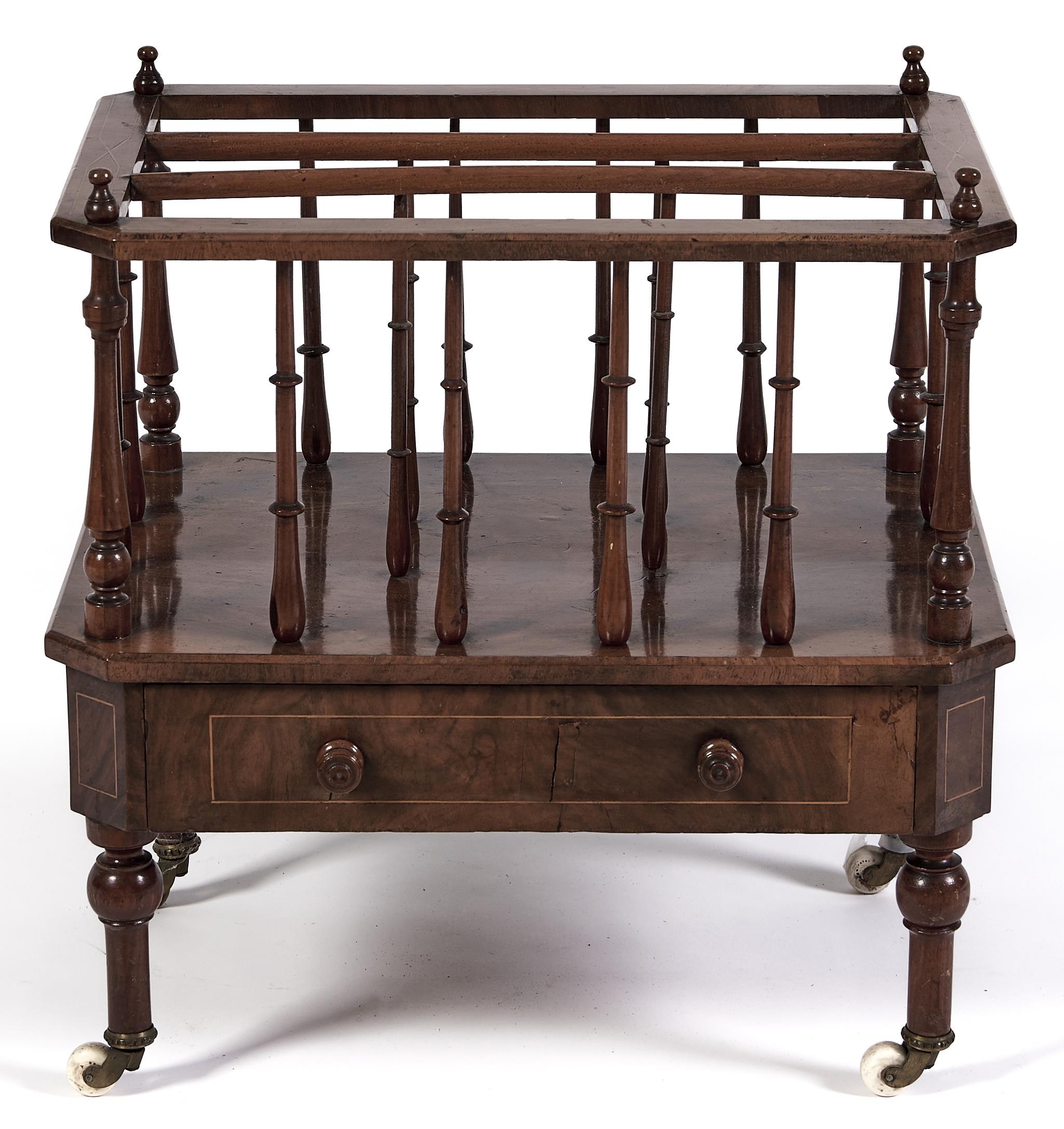 A Victorian walnut canterbury, quarter veneered and line inlaid, fitted with a drawer, on turned