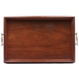 An Edwardian mahogany two handled tray, c1910, of rectangular outline with flared border and pair of
