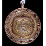 A 9ct gold watch fob prize shield, 23mm, marks rubbed, Birmingham 1920, 3.6g Slightly rubbed